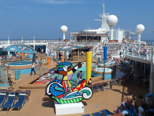 Pool Deck with Romero Britto's Surfer Boy Sculpture aboard Mariner of the Seas