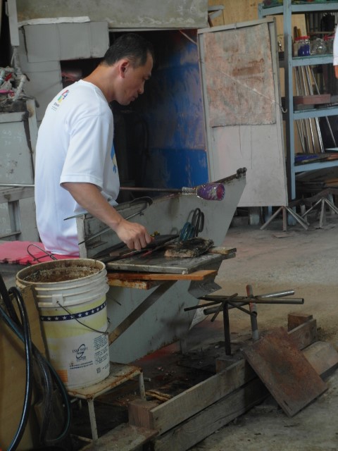 Master doing glass making demonstration