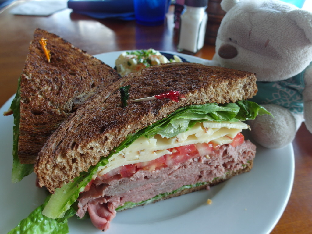Piled High Roast Beef - Chilled, served on marble rye, smoked gouda, lettuce and tomato, with Potato Salad