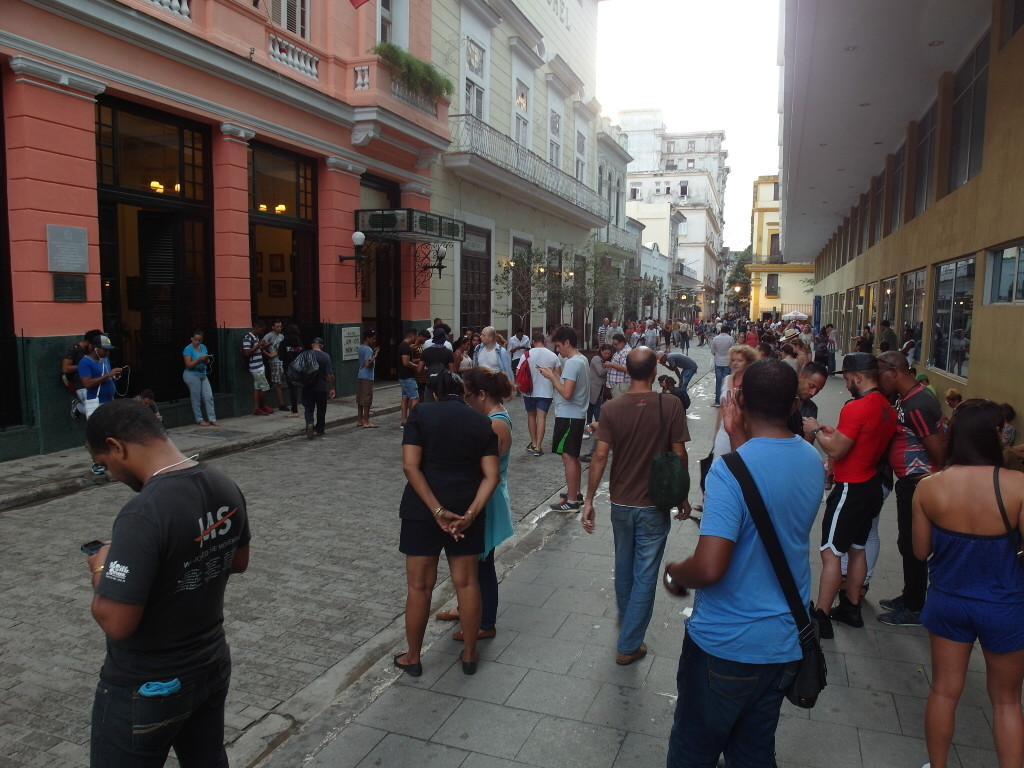 Tourists using Etecsa Wifi Hotspot