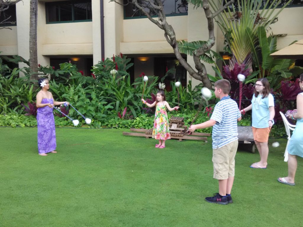 Leaning to Swing Hawaiian Poi Balls at the Luau