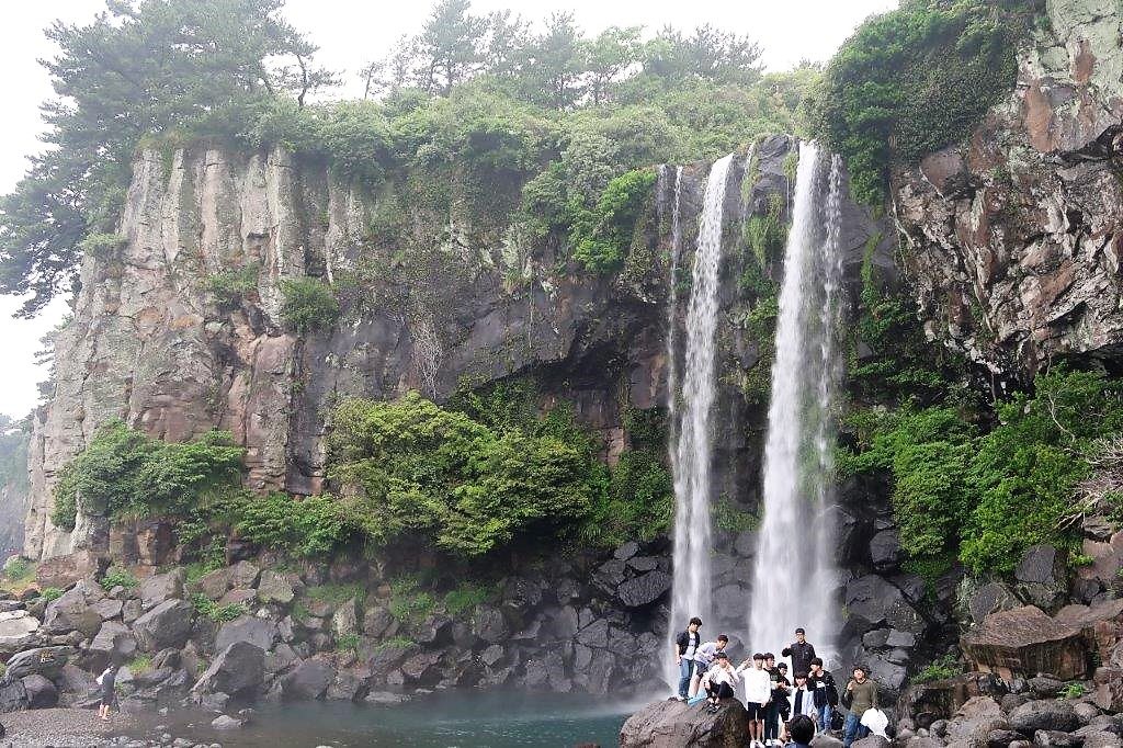 Tourists at Jeongbang Falls Jeju