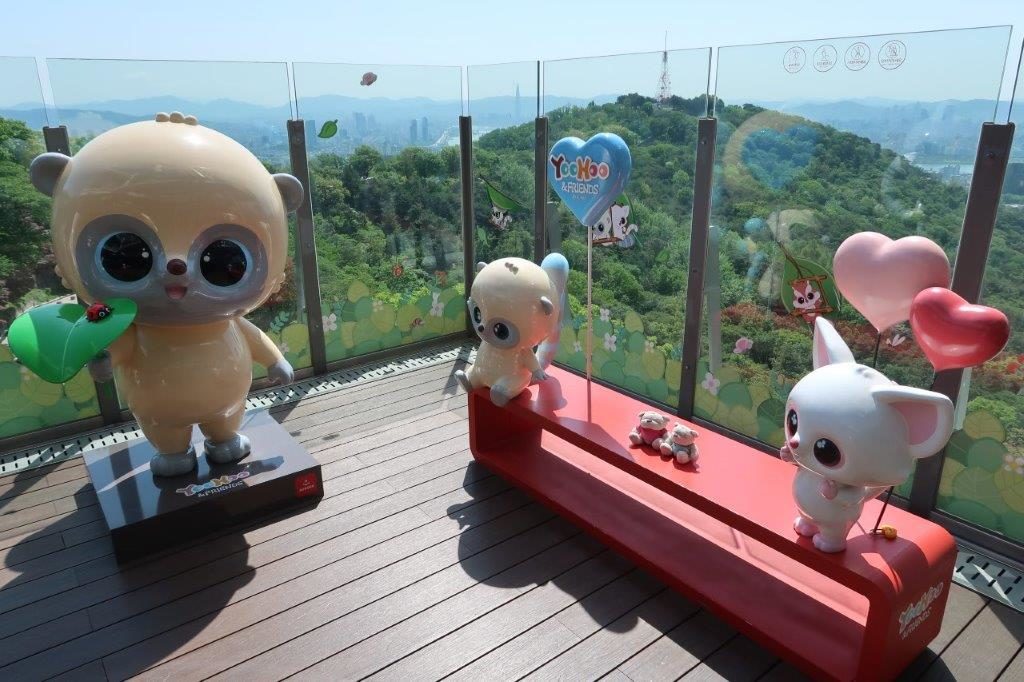 Seoul Tower Cartoon Characters with view in the background