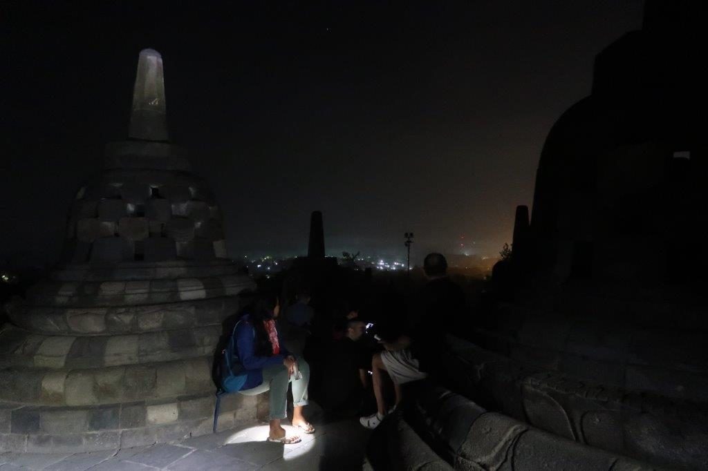 Sitting down while waiting for the sun to rise at Borobudur
