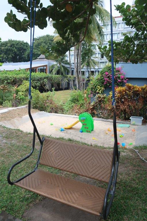 Sand pit/swing swing by the swimming pool