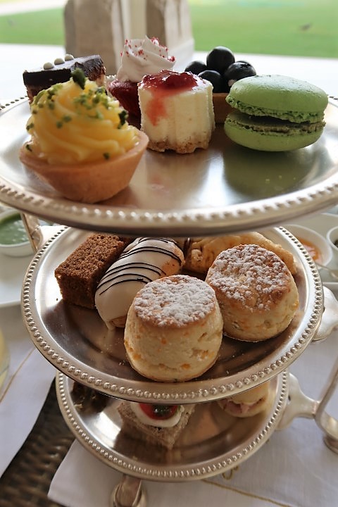 Zooming in on the sandwiches, pastries and scones of afternoon tea snacks at Taj Rambagh Palace Hotel's Verandah Cafe