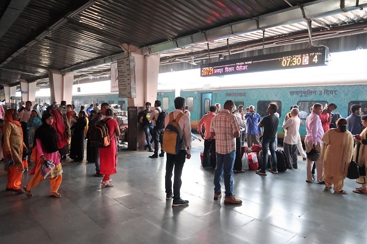 Passengers boarding trains at Jaipur Train Station in an orderly manner