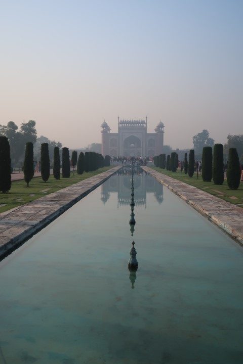 Reflective pool and entrance of the Taj Mahal