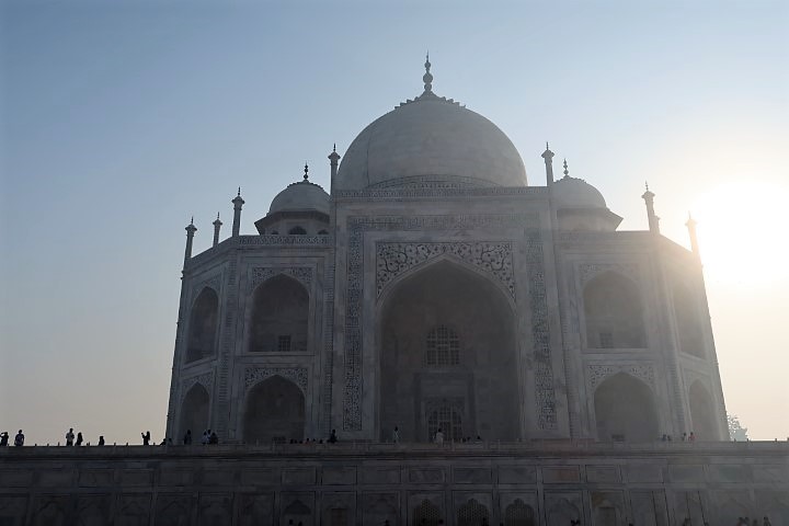 Artistic shot of sunlight peaking over the Taj Mahal