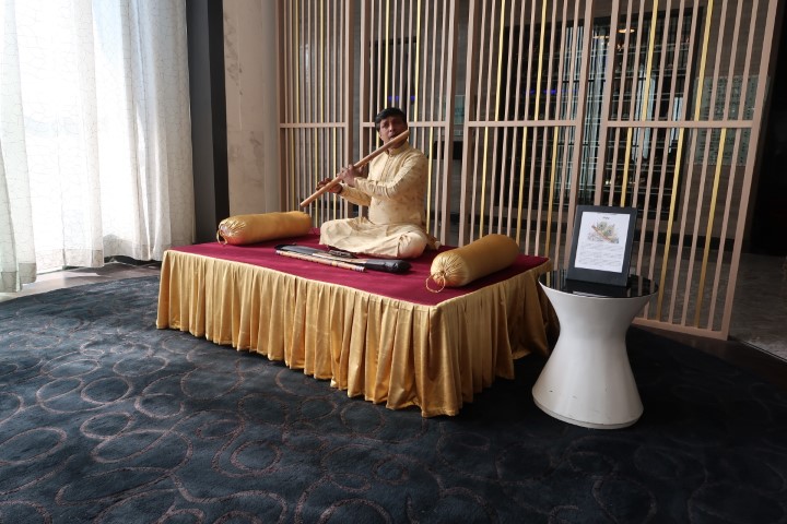 Traditional Indian Bamboo Flute Player playing tunes on the Bansuri