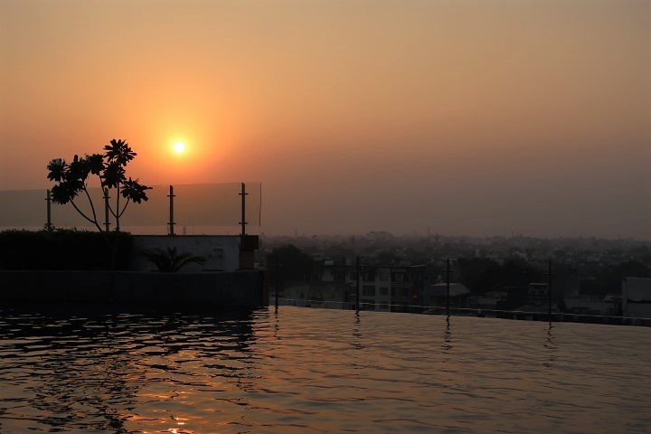 Sunset in Agra as seen from infinity pool of Hotel Radisson Blu Agra Taj