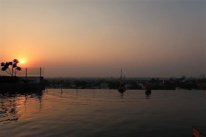 Enjoying the sunset from the edge of the infinity pool at Hotel Radisson Blu Taj Agra East Gate