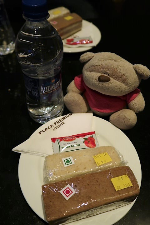 Sandwiches and water in Premium Plaza Lounge Delhi Airport Terminal 1