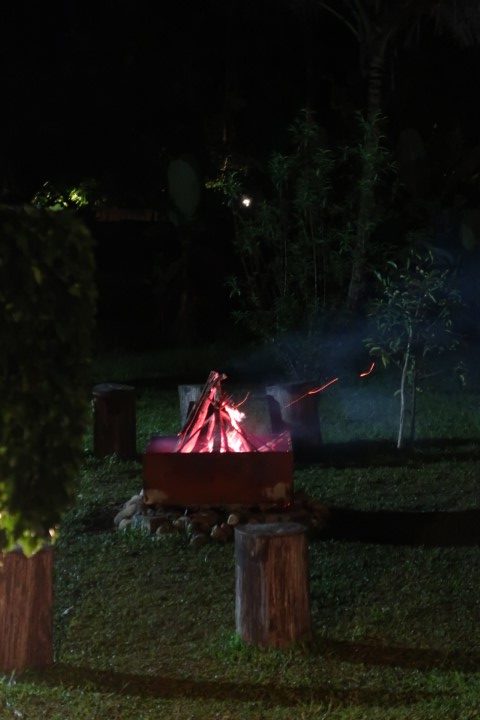 Outdoor fire pit lit up at night...