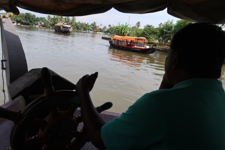 Captain Ashok at the helm of our Alleppey Cruise Boathouse