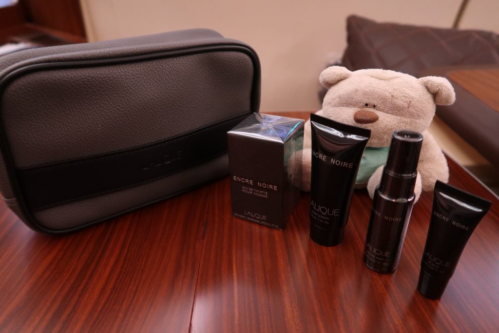 SQ First Class Suites Lalique Amenities for Men including cologne, body lotion, facial mist and aftershave