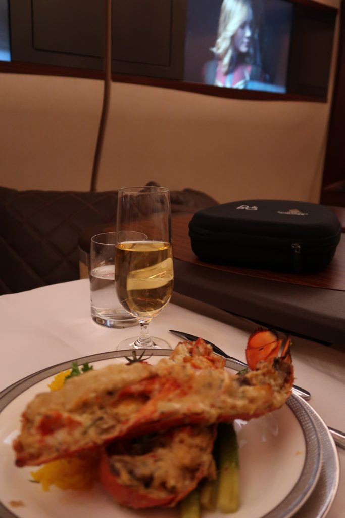 Watching Captain Marvel with sipping champagne and enjoying a whole lobster on SQ First Class Suites