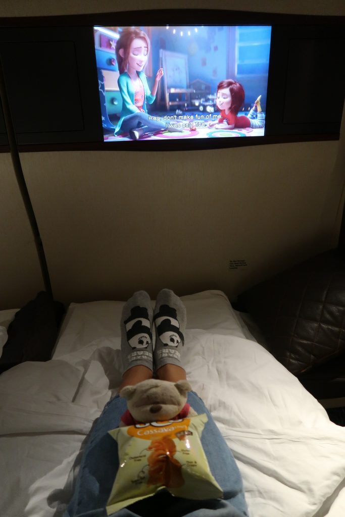 Kate enjoying wonderland on fully reclined beds of SQ First Class Suites