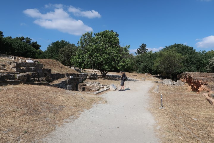 Tom reading the inscriptions at Ancient Agora