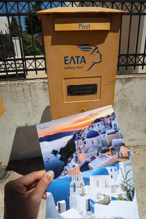 Sending Greek post cards back home to Singapore