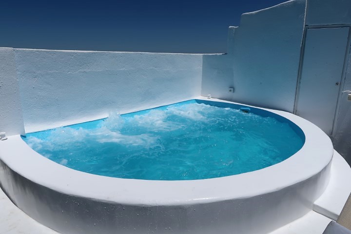 Another view of rooftop jacuzzi at Kafieris Apartment on the Cliff Fira Santorini
