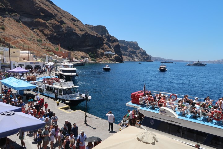 Cruise ship passengers arriving on tender boats at Fira Old Port
