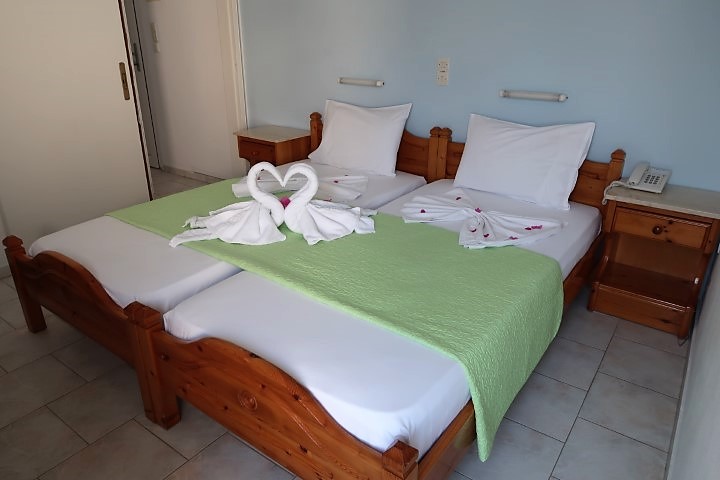 Marinos Hotel Paros Bed with Towel Art