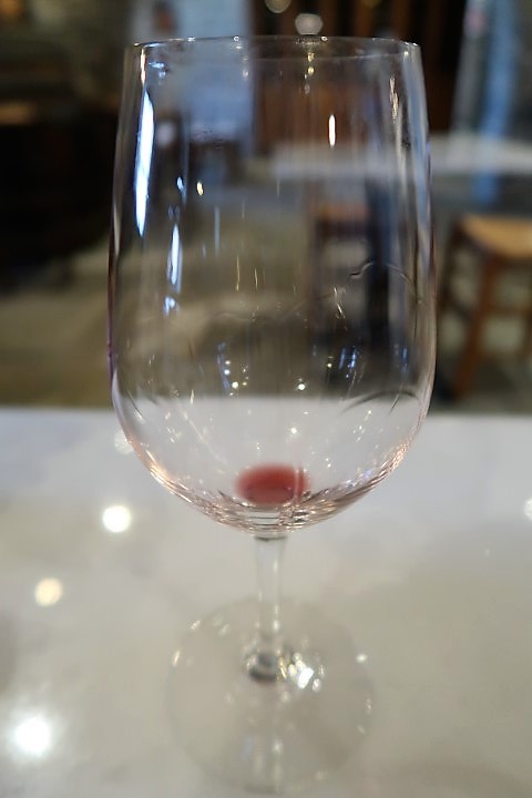 Tear drops forming on sides of the wine glass - a sign of a good wine