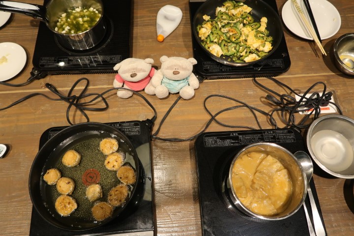 4 dishes on the stove concurrently at Taste of Okinawa