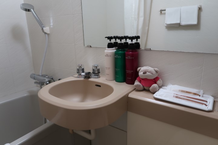 Bathroom of room at Hotel Maruki Okinawa