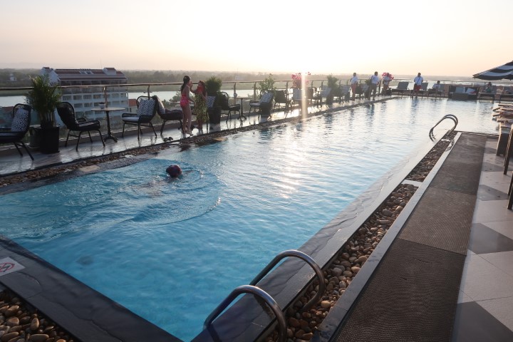 Rooftop Swimming Pool during sunset at Hotel Royal Hoi An
