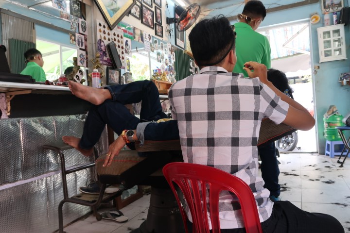 Tom getting his haircut in Da Nang