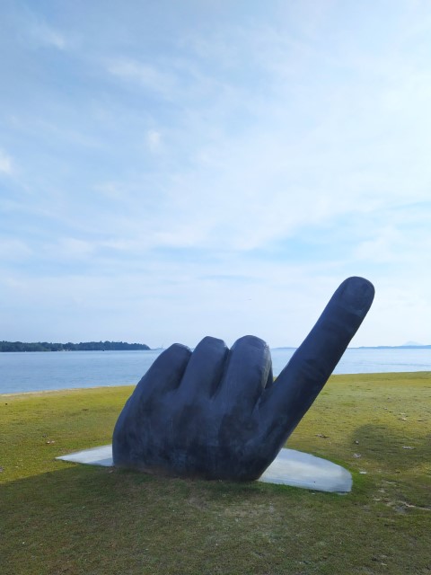 Index Finger Hand Statue at Changi Beach Park