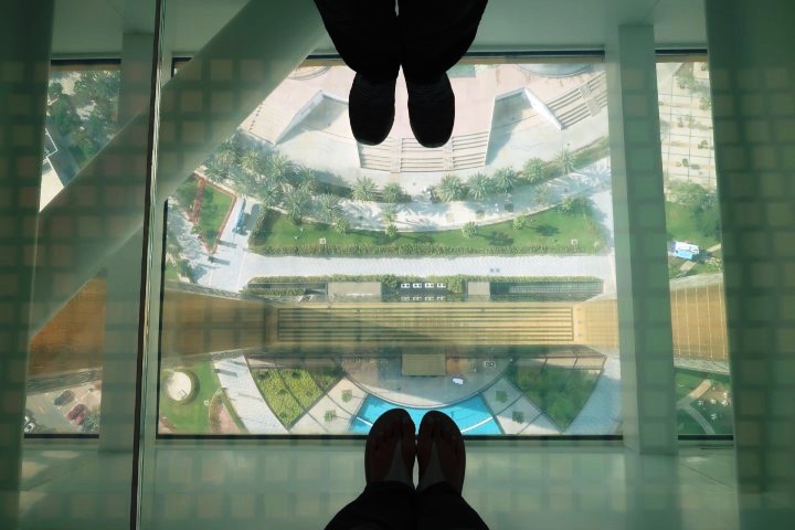 2bearbear at top of Dubai Frame's motion-activated glass floors