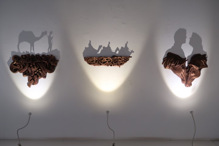 Unique sculptures casting shadows when light is shown from the bottom - MAKE Art Cafe Dubai