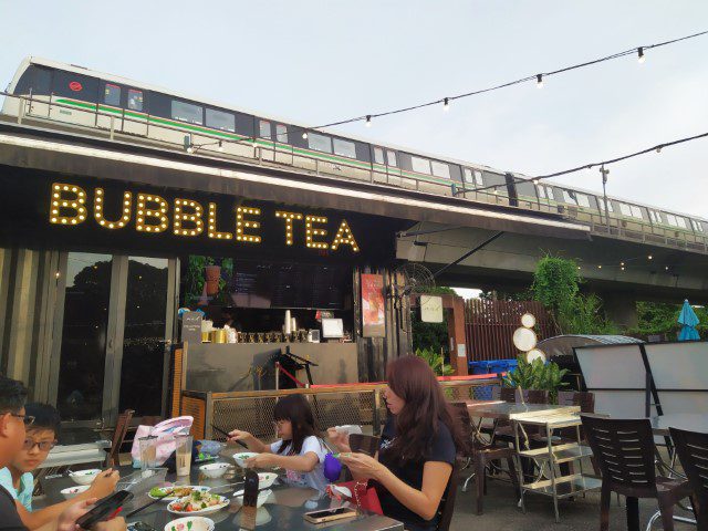 Bubble Tea Shop next to BKK Bistro and Bar ORTO with MRT passing overhead