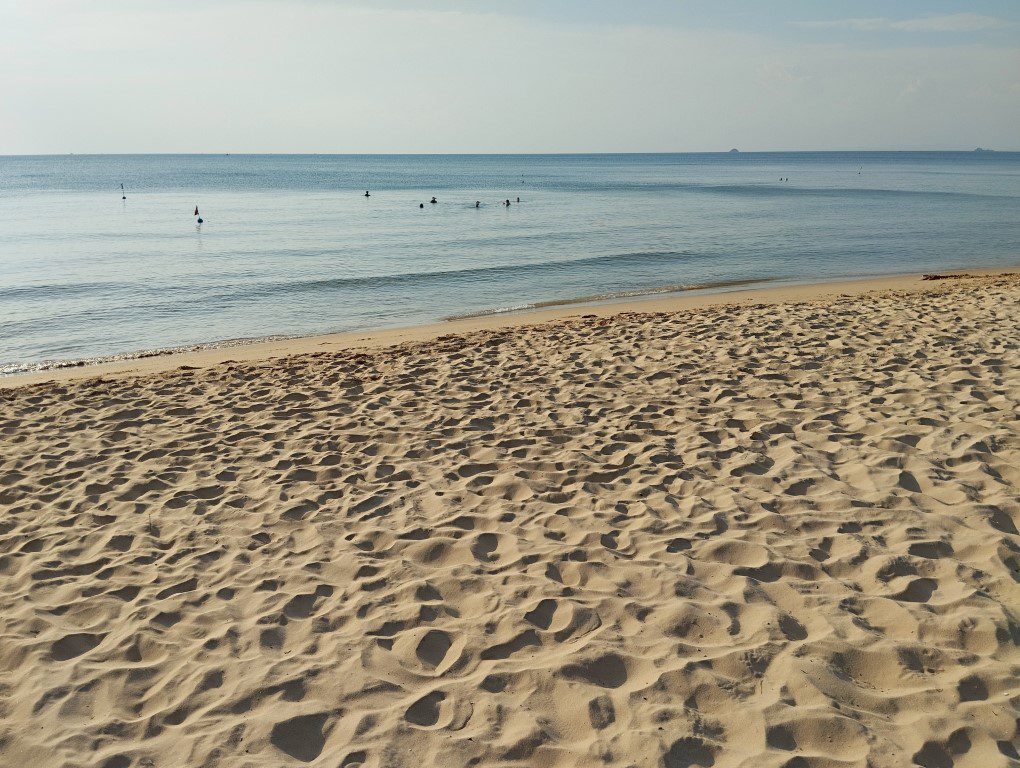 Pristine beach at Vinpearl Resort & Spa Phu Quoc with clear blue waters