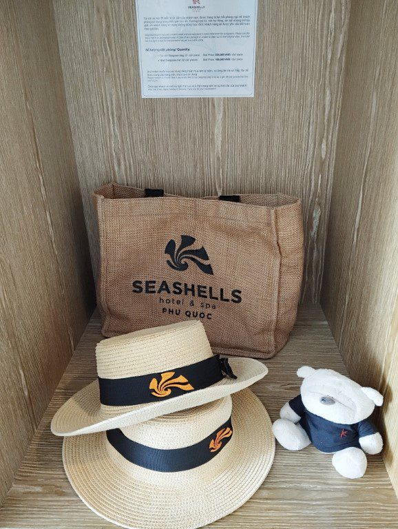 Premium Ocean View King Bed Seashells Phu Quoc Hotel & Spa Review - Bag and hats for guests to use during the stay