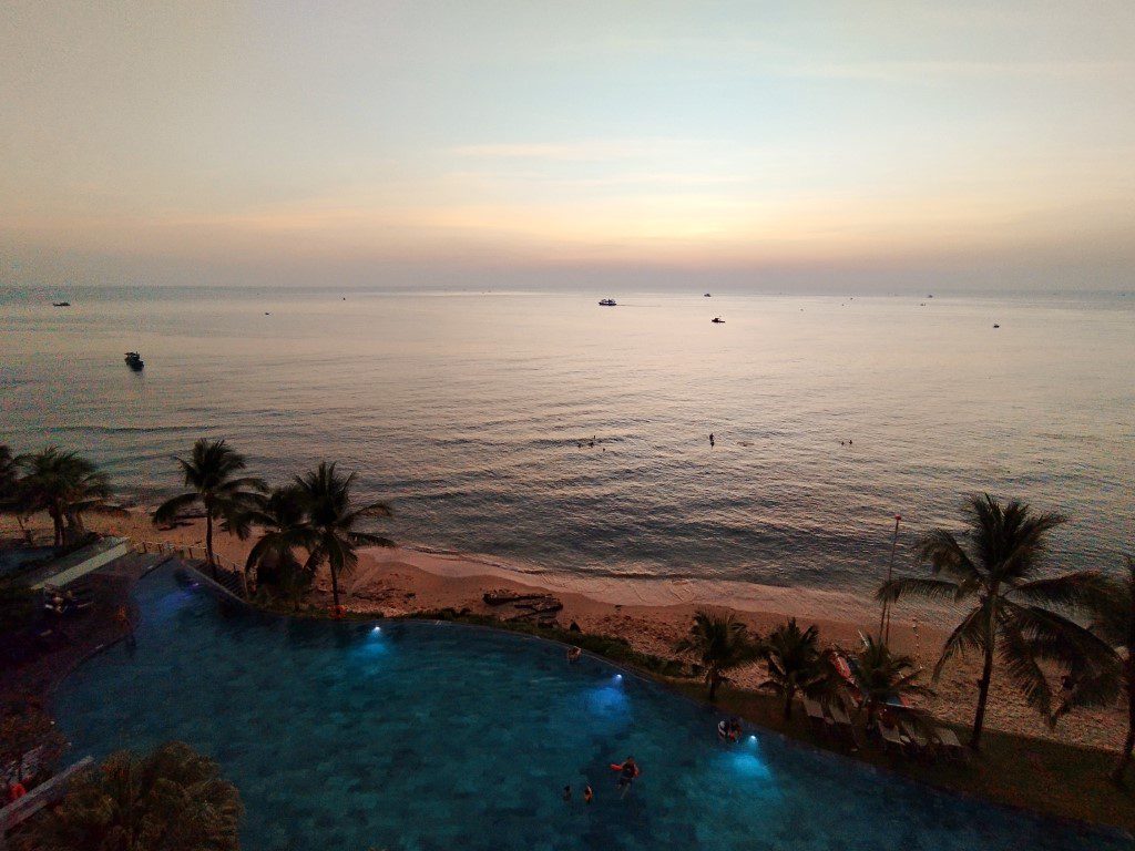 Sunset as seen from Seashells Phu Quoc Hotel & Spa from our Premium Ocean View Room - Swimming Pool lights up after sunset