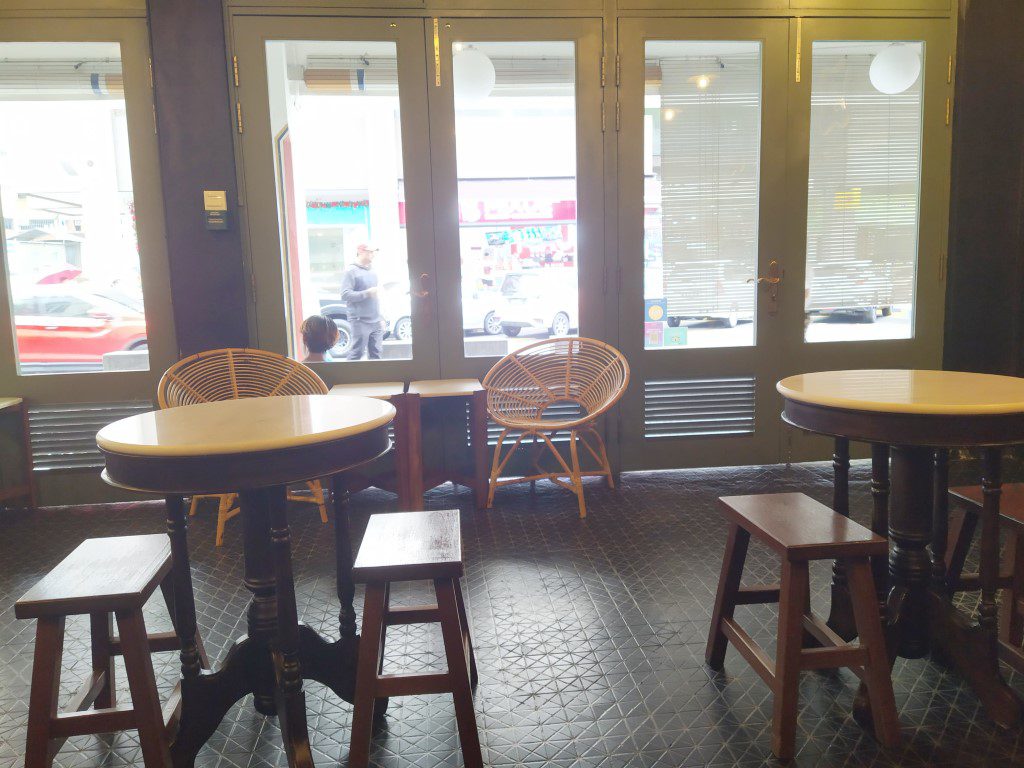 "Kopitiam" stools and tables inside Lim Kee Cafe KL