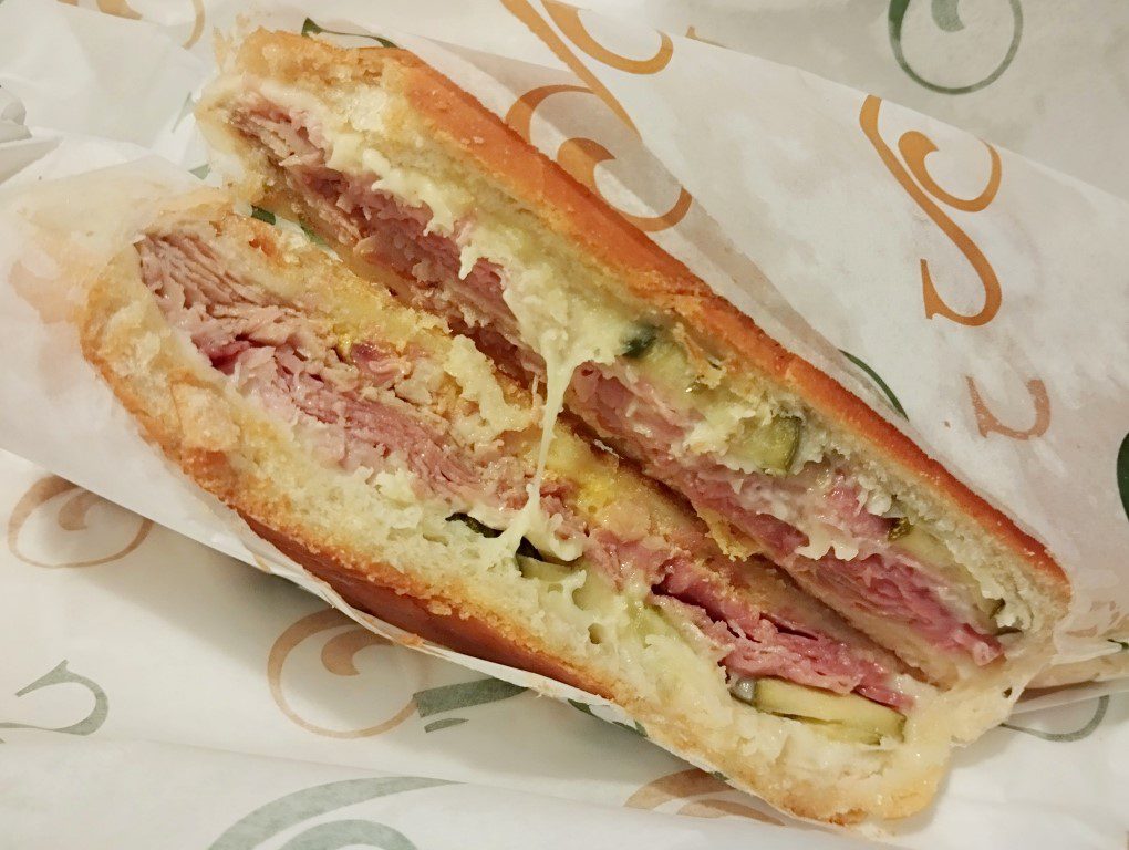 Sanguich Cubano Sandwich - $13.49 pork spiced ham swiss cheeses, pickles and mustard on Cuban bread) - enjoyed at Hotel Ponce De Leon Miami