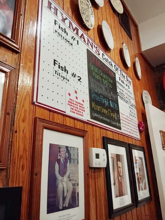 Hyman's Seafood Catch of the Day and photos of  past owners