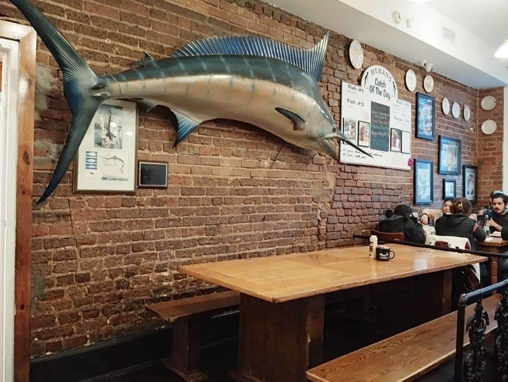 Inside Hyman's Seafood Charleston - A Huge Marlin Hangs on the Wall