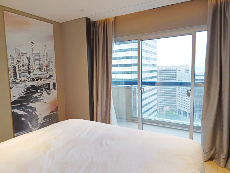 Swissotel The Stamford Hotel Signature Suite - View from King-sized Bed